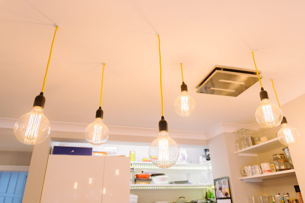 Industrial exposed hanging lightbulbs photographed in Stroud Green North London for Davies & Davies Estate Agents blog