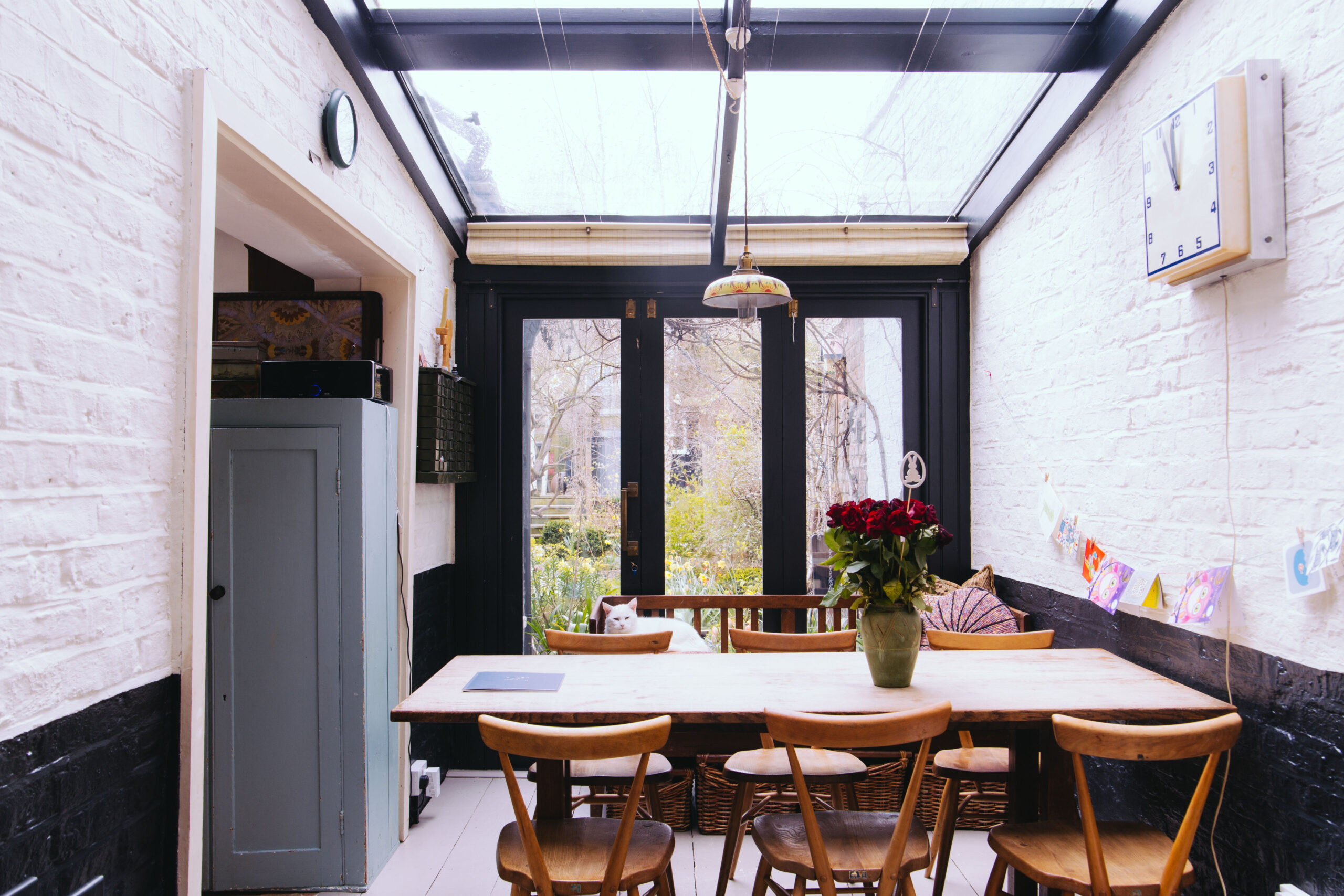 A picture of a dining room of a property sold at Davies & Davies with a cat resting on the chair