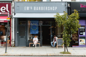 The exterior of Em's Barbershop.