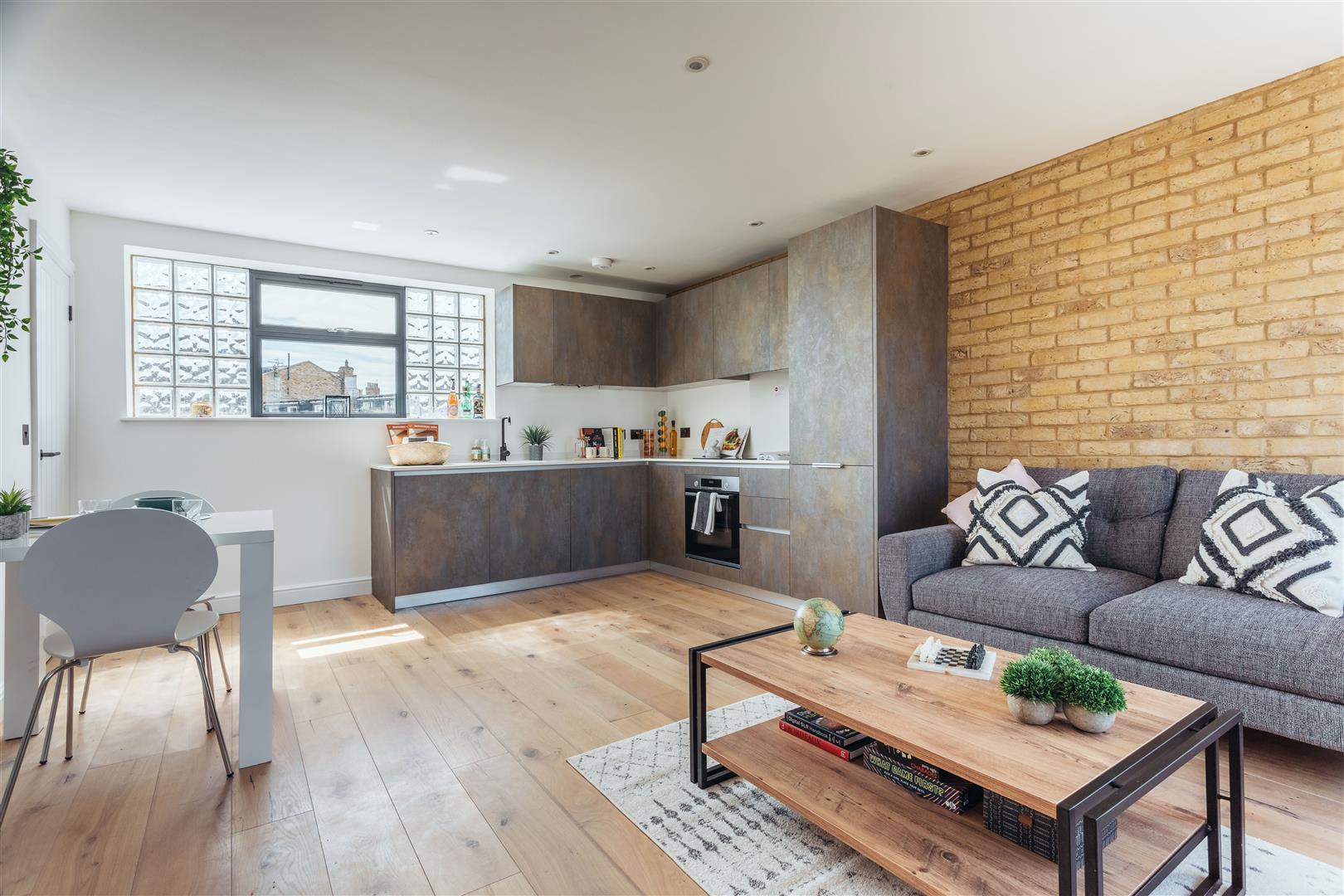 The Living Room of a 1 Bed Maisonette Currently For Sale in the Creatively Imagined Ironworks Yard, Sold by Davies & Davies Estate Agents.