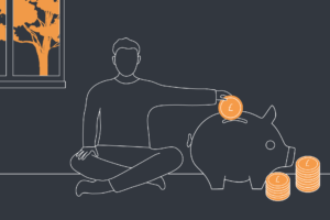 Person putting savings into a piggy bank