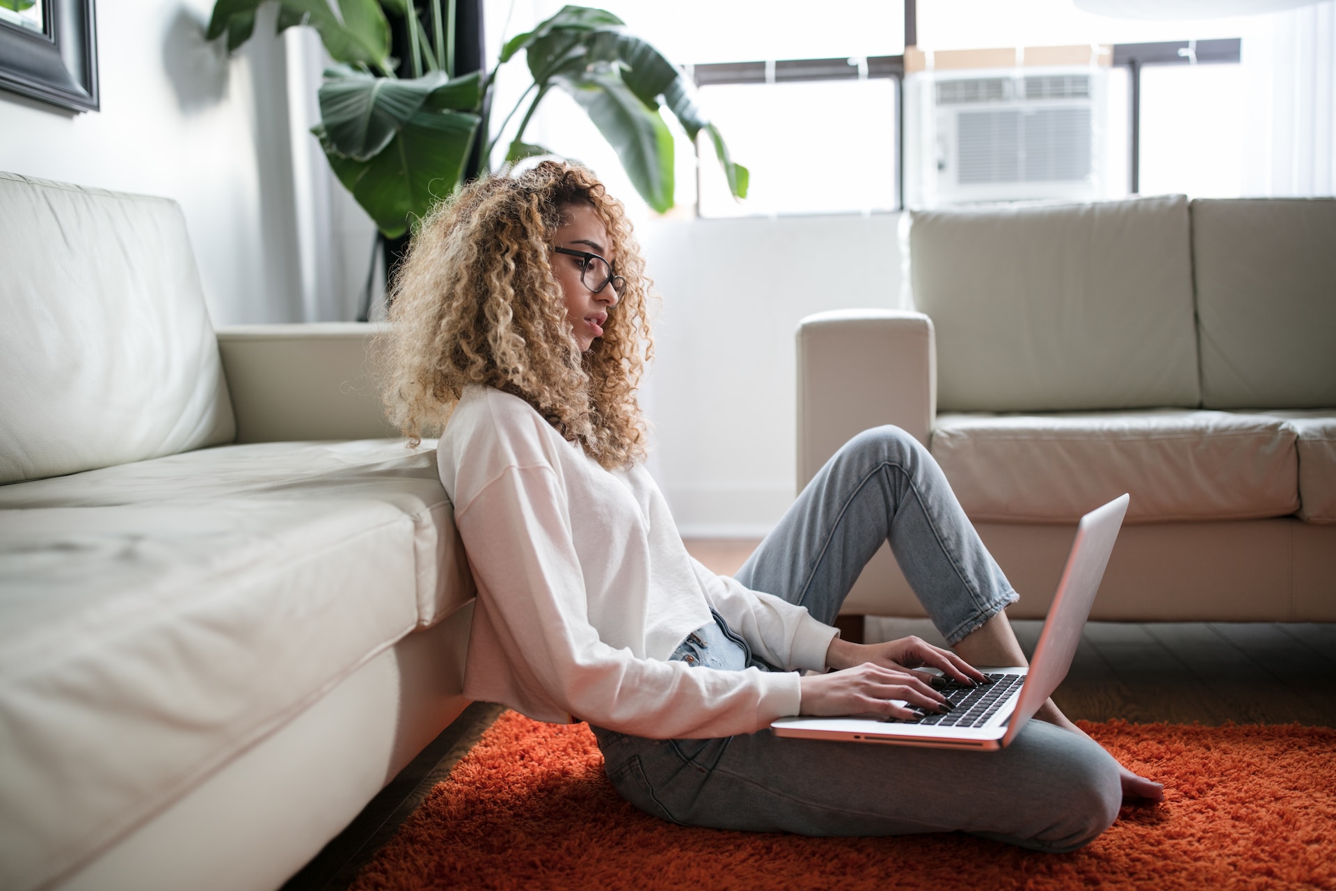 Photo of young woman on her laptop 